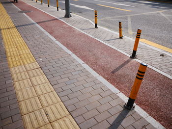 Bollards on sidewalk in city