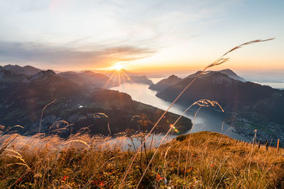 Scenic view of land against sky during sunset