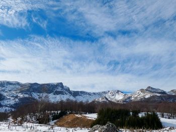 Scenic view of snowcapped mountains against sky