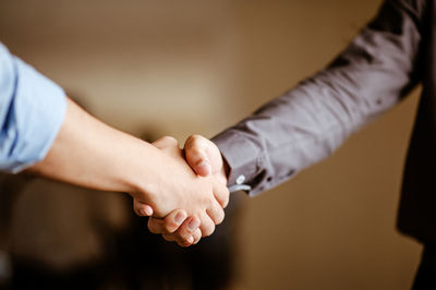 Close-up of business people shaking hands