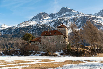 Switzerland, february 21, 2023 historic old castle crap da sass at the lake of silvaplana 
