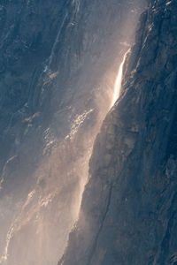 Aerial view of mountain range against sky