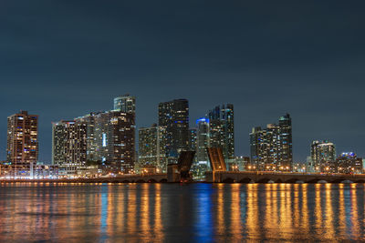 Illuminated buildings in city at night