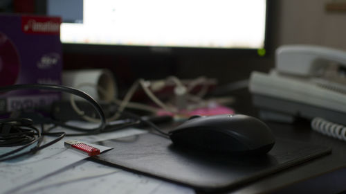 Close-up of computer mouse on table