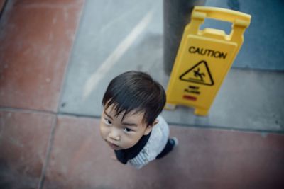 High angle view of boy with text