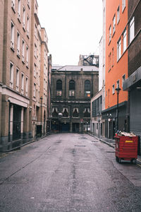 Street amidst buildings against sky