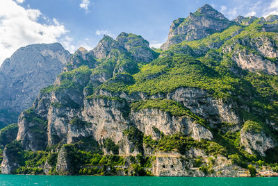 Scenic view of sea and mountain against sky