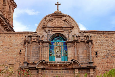 Ornate facade of basilica menor de la merced in the historic center of the city of cusco, peru