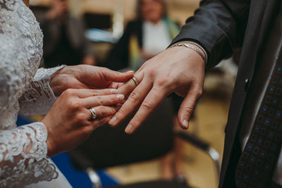Midsection of man holding hands