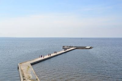 Pier over sea against sky