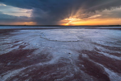 Scenic view of salty lagoon located near sea in penahueca under sundown sky