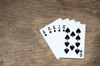 Close-up of playing cards on wooden table