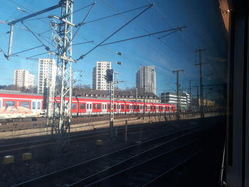 Train in city against sky