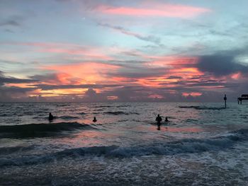 Scenic view of beach against sky during sunset