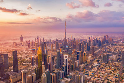 View of cityscape against sky during sunset