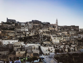 High angle view of old buildings in city against sky