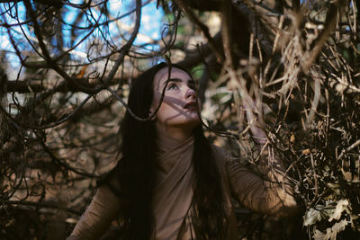 Woman among trees