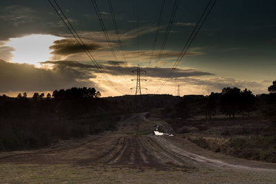 Scenic view of road against sky during sunset