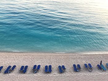 High angle view of chairs on beach