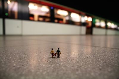 People walking on street in illuminated city