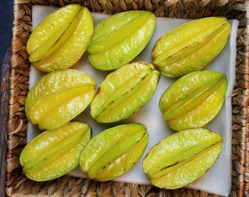 High angle view of green chili peppers on table