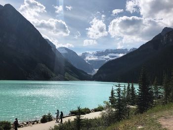 Scenic view of lake and mountains against sky