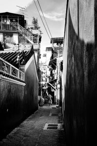 Alley amidst buildings in city