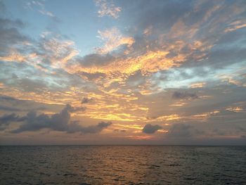 Scenic view of sea against sky at sunset