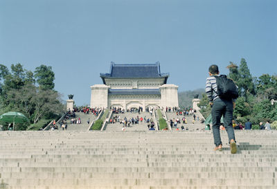 People in front of historical building