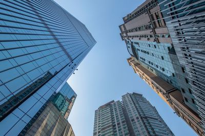 Low angle view of modern buildings against clear sky