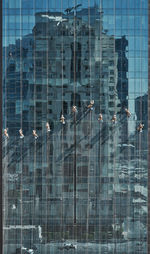 Reflection of building in swimming pool