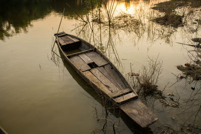 Boat moored in lake