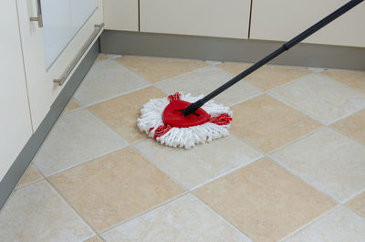 Mop on a kitchen floor during a housework