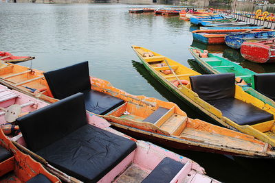 High angle view of fishing boats moored at harbor