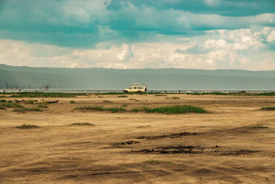 View of an off road vehicle on the shores of lake nakuru in lake nakuru national park in kenya