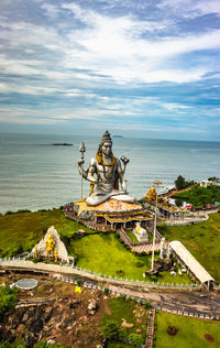 Shiva statue isolated at murdeshwar temple aerial shots with arabian sea in the backdrop