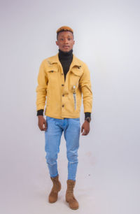 Portrait of young man standing against white background