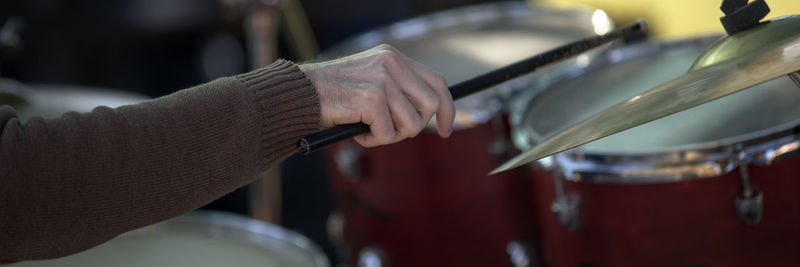 Close-up of person playing guitar