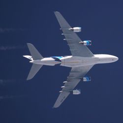 Low angle view of airplane flying in sky