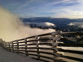 Scenic view of snow covered mountain against sky