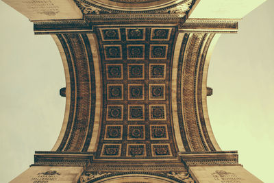 Directly below shot of arc de triomphe against sky