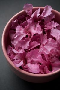 High angle view of pink roses in bowl on table