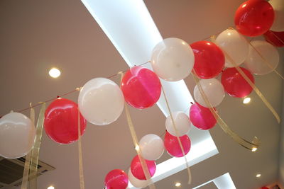 Low angle view of balloons hanging from ceiling