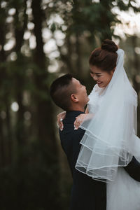 Midsection of man and woman standing on floor