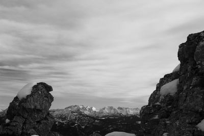 Low angle view of rock formation against sky