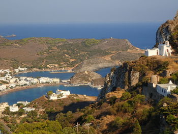 High angle view of townscape by sea against sky