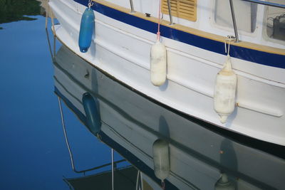 Sailboat moored in sea