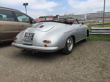 Vintage car on road against sky