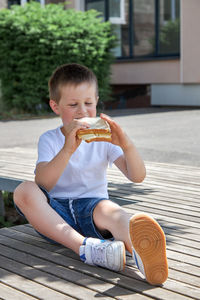 Healthy food for children at school. the boy eats a homemade sandwich, lunch or snack 