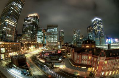 Illuminated city street at night